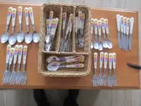 A quantity of very pretty cutlery , great for a picnic.