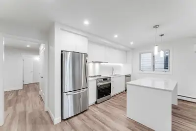 Welcome to 239 Breezehill Avenue South! This luxurious 4-bedroom apartment is a fantastic opportunit...