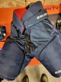 Blue hockey pants and gloves