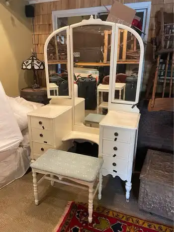 Beautiful vintage vanity dating back to the 1920s. Features a large triple mirror, six drawers, eleg...