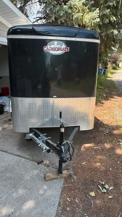 2024 CargoMate 5x8 enclosed trailer very lightly used ! Comes with spare tire,in side tie downs 2 ro...