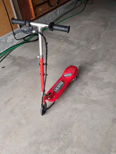 Electric Scooter for sale... 2 years old. Bright red. Charges up and works great still. Fun for kids...