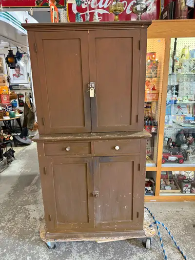 Great rustic farmhouse cabinet. Old cracked brown finish. Dimensions are in the photos $595 plus gst...