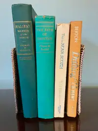 Books by Thomas Raddall, Pierre Berton, and Will R. Bird