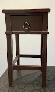 This is a solid wood side table and a deep dark brown colour. The basket is removable as shown for e...