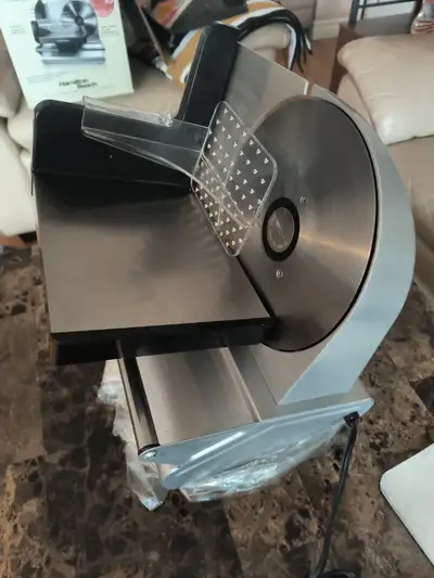 Meat slicer stainless steel very little use, almost new. Asking $50 obo.