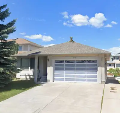 4-BEDROOM in Sandstone Valley! This spacious walkout bungalow features formal living room, formal di...