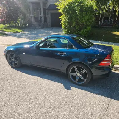 2000 Mercedes-Benz SLK 230 is a head-turner with its mesmerizing pearl paint job—shifting between de...