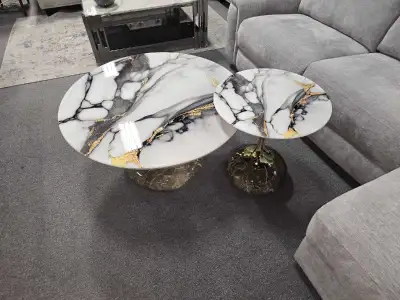 Elevate your living space with this brand new set of marble-top coffee and end tables, boasting a gl...