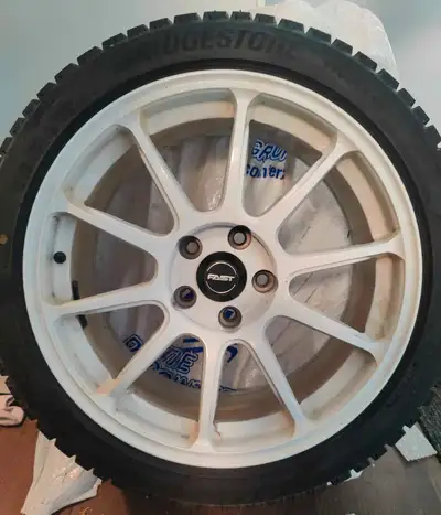 Winter Tires On Rims! 225/45R18 Four gently used BRIDGESTONE tires (like new) on FAST rims, 4 years...