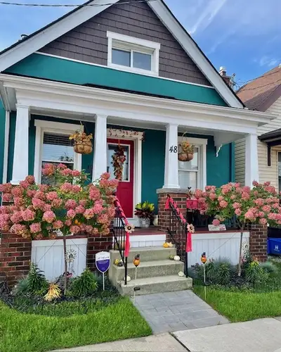 Just move right in and in and enjoy. Beautiful yard, deck, parking at rear, professionally finished...