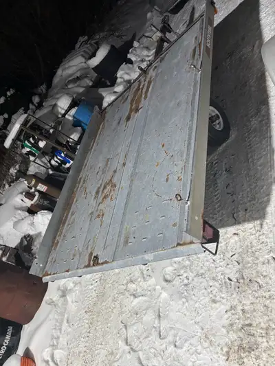 This double tilting snowmobile trailer is ready for the winter season! This trailer is used and incl...