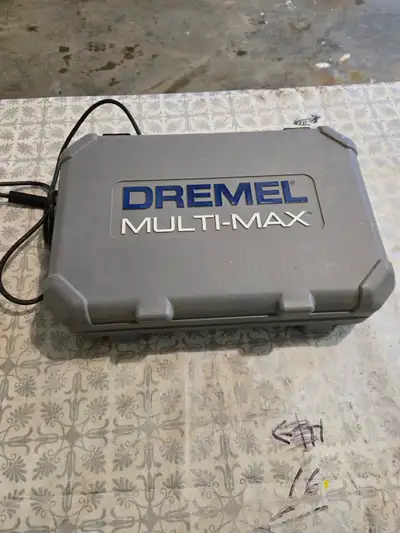 Dremmel Multi-Max corded 5 amp. variable speed tool set with a few accessories and in a hard case.