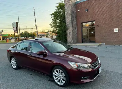 This 2014 Honda Accord Touring is a reliable and well-maintained used sedan, featuring a powerful en...