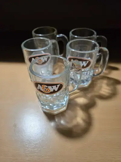 These charming A&W glass mugs are the perfect addition to your collection, featuring a set of five m...
