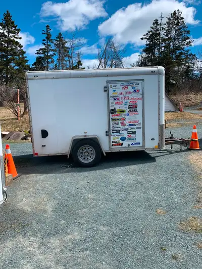 6x10.5 enclosed trailer 75inch high inside Great shape no leaks doors work fine tows nice. Solar pan...