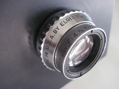 Timers,..Easels.. enlarger lenses, lens mounting cones for Omega enlargers. SS developing tanks and...