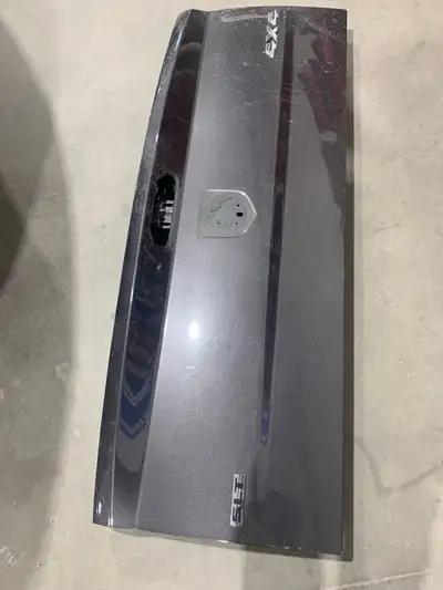Dodge Ram tail gate for sale has hail damage
