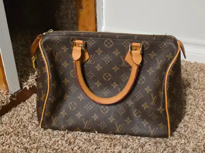 It is not real LV Replica Speedy handbag Dark brown base, tan monograms and symbols, gold toned hard...