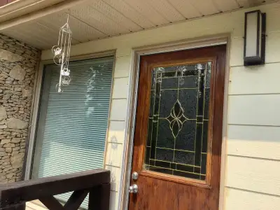 Located at Jan Lake, Sask. Beautiful cabin/house with a huge lot and lots of trees, bushes, flowers...