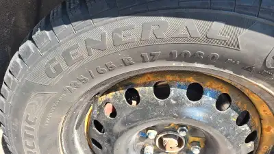 4 Wheels (Steel Rims). Loads of tread on 2 tires. The other 2 are not so great. Smooth driving thoug...
