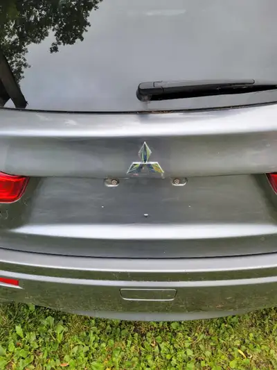 2011 mitsubishi rvr, trunk lid..located in foresters falls..