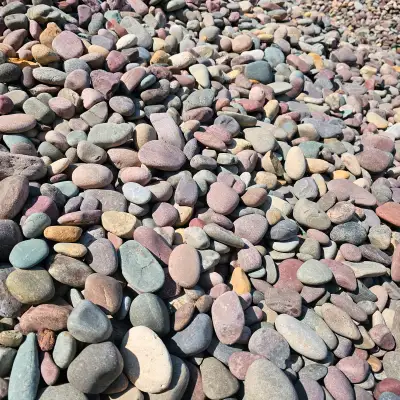 Upgrade your outdoor space with 40mm Montana Rainbow Rock. This decorative landscaping rock is perfe...