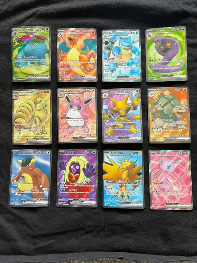 Selling 12 full art Pokémon cards from the Pokémon 151 set. Cards are in excellent condition (NM). P...