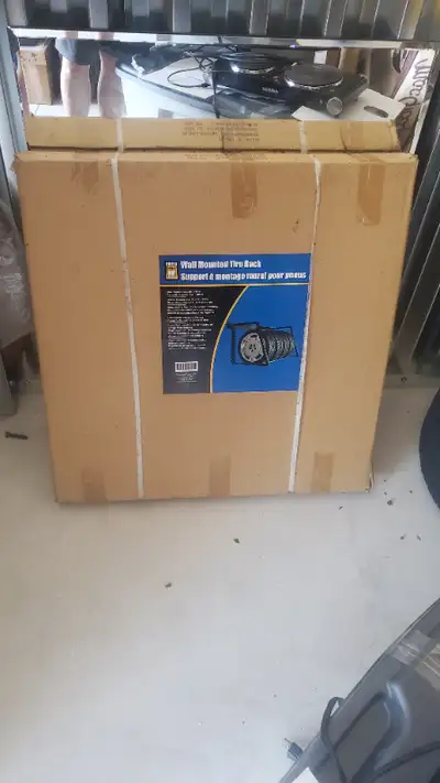 Brand New Sealed in Box Power Fist wall mount tire rack. Holds up to 400lbs. $40 no tax = a good dea...