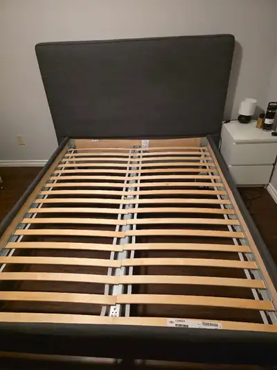 Dark grey upholstered queen size bed frame. Very sturdy, great condition. 80" long 71" wide 52" high...