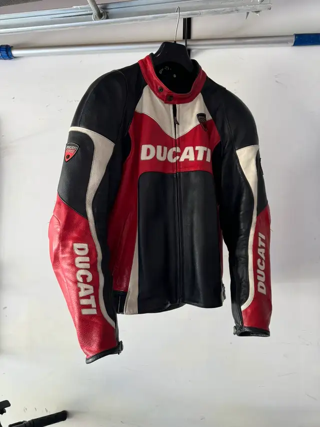 Motorcycle leather jacket (56) and pants (54)628643635495691214