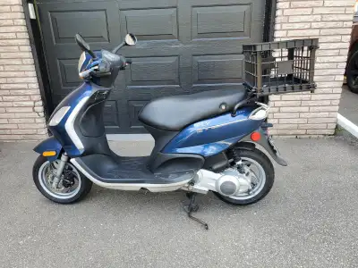 Scooter, 2010 Piaggio (Vespa) 150cc Fly with only 2809 kms on it. This scooter is like new and is ve...
