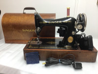 A.sewing machine singer model 99-13