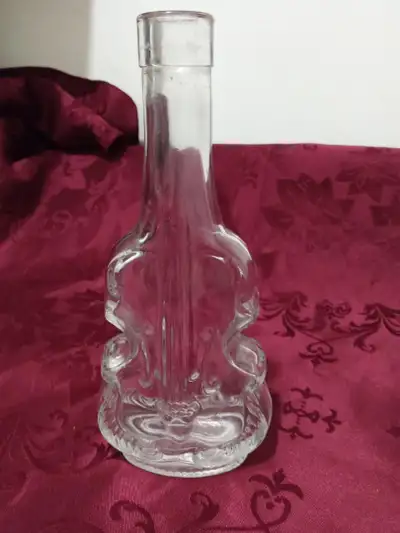 This is an exquisite vintage violin bottle. It is made of thick clear glass, that adds some substant...