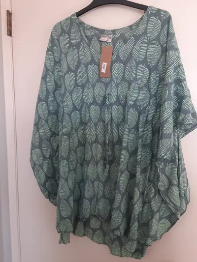 Purchased in hawaii 100% rayon Flutter sleeves with drawstring tie New with tags One size fits most