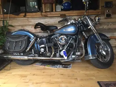 good running Harley Shovelhead...mostly original...new single saddle on a pogo...vintage leather bag...