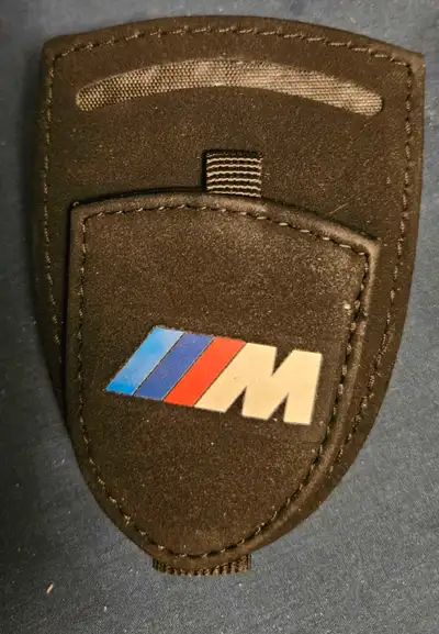 Elevate your driving experience with this sleek B.M.W. sunglasses holder, featuring the iconic M bad...