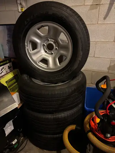 Bridgestone 275/65R18 116 M+S 4 tires with rims on, almost new very lightly used.