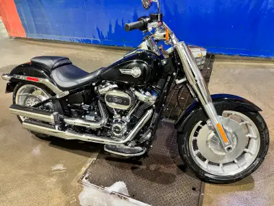 I am selling a 2024 Harley-Davidson Fat Boy, a powerful cruiser motorcycle with a muscular stance an...