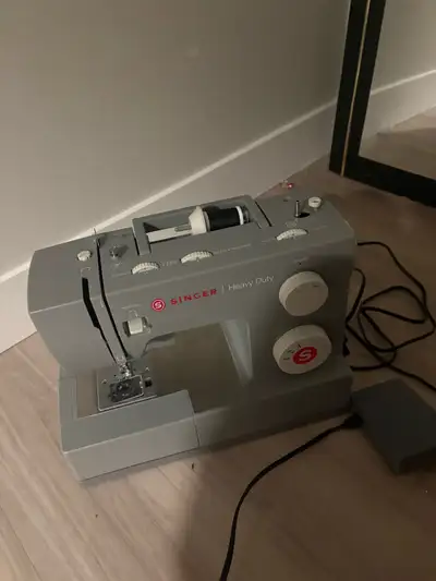 PRICE NEGOTIABLE!! I'm offering a Singer Heavy Duty sewing machine because i don’t know how to use i...