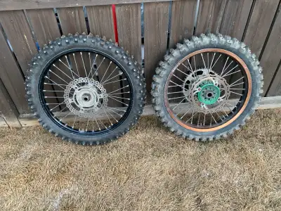 Set of wheels and studded tires for a Kawasaki KX. Will fit a wide range of years in both the two st...