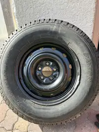 1 - 235 70R16 tire on steel rim