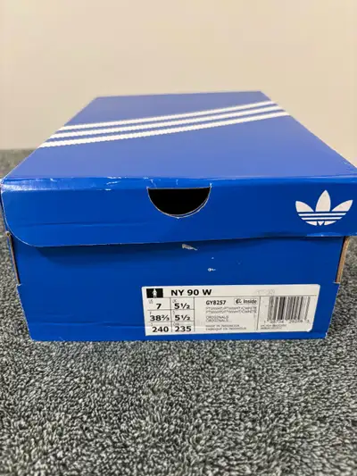 Brand new never worn white Adidas sneakers. Original box and tags, size 7