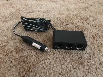 Selling a 3-way car cigarette light splitter in good used condition. It is equipped with a 10 amp re...