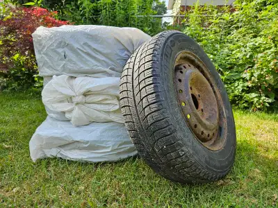 Four winter tires on rims 195/65 R15 Tires have been regularly rotated and stored in a shed in the o...