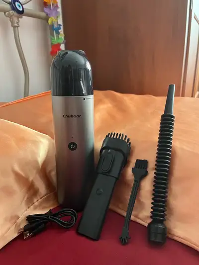 Cordless Handheld Vacuum with Cleaning Brush, Suction Nozzle, and Blower. Charging cable and storage...