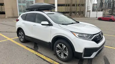 For sale is a 2022 Honda CR-V AWD in a clean white exterior, currently at 120,000 km. This SUV has b...