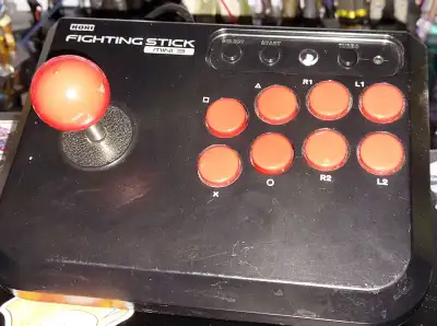 Mini arcade stick for PS3 and PC. Has turbo feature and works good!