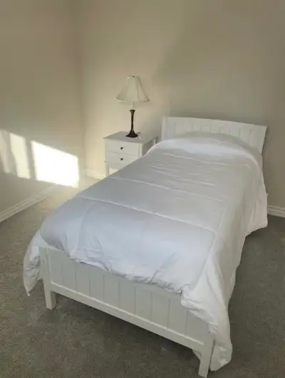 A bright, clean, and fully furnished room .This room features a comfortable bed, a large dresser, an...