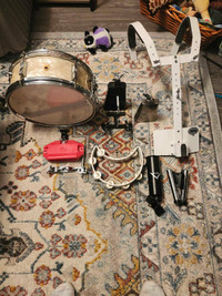 Assorted percussion items including vintage Ludwig snare drum.